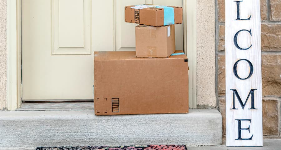 Deliveries on the front porch of a house with a welcome sign in Chico